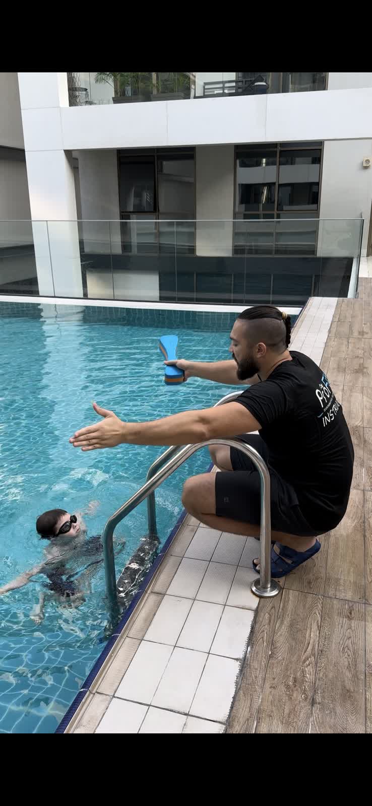 Swimming lesson at apartment pool